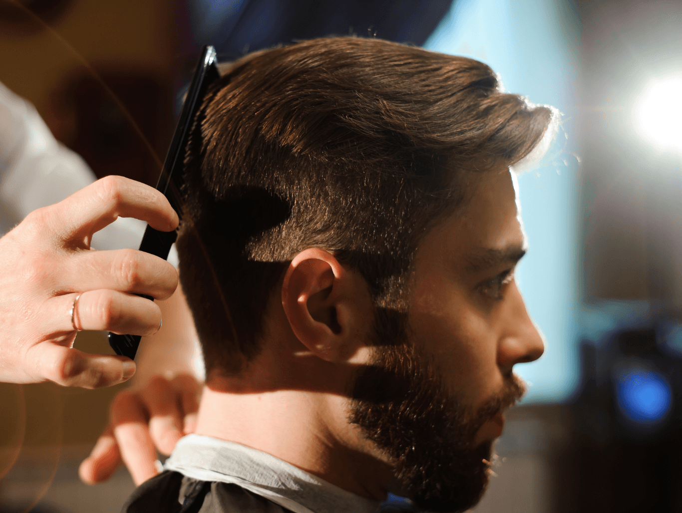 Man receiving a precision gents cut and blow dry at John Richards Hairdressing in Allington, Maidstone, showcasing a sharp, polished hairstyle.