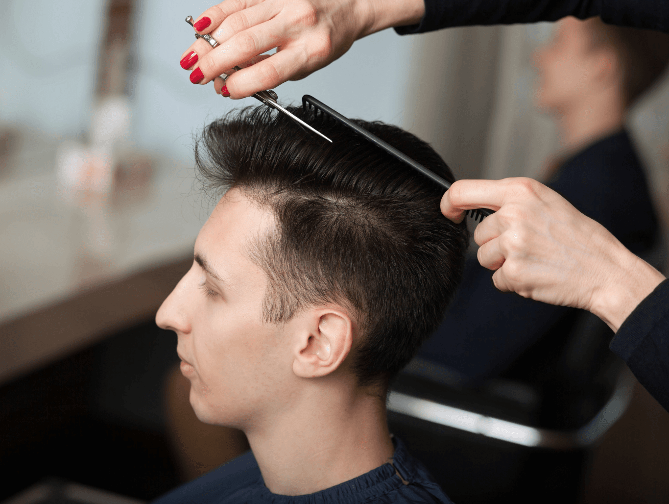 Man receiving a precision gents wet cut at John Richards Hairdressing in Allington, Maidstone, showcasing clean, sharp barbering work.