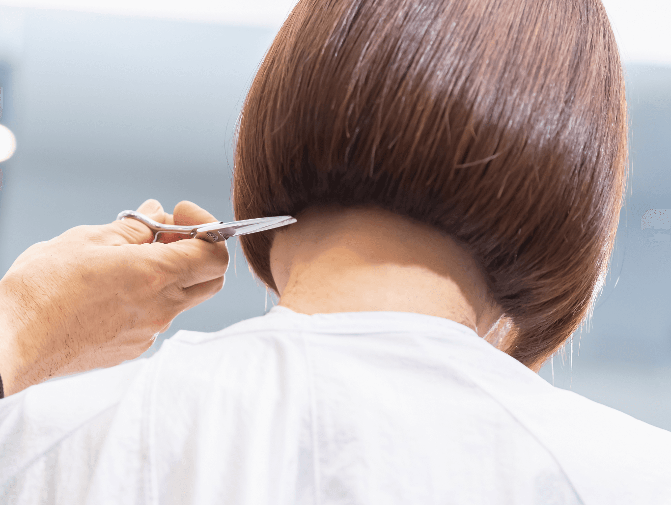 Close-up of a precision bob haircut being shaped at the nape by a professional stylist at John Richards Hairdressing, Allington, Maidstone.