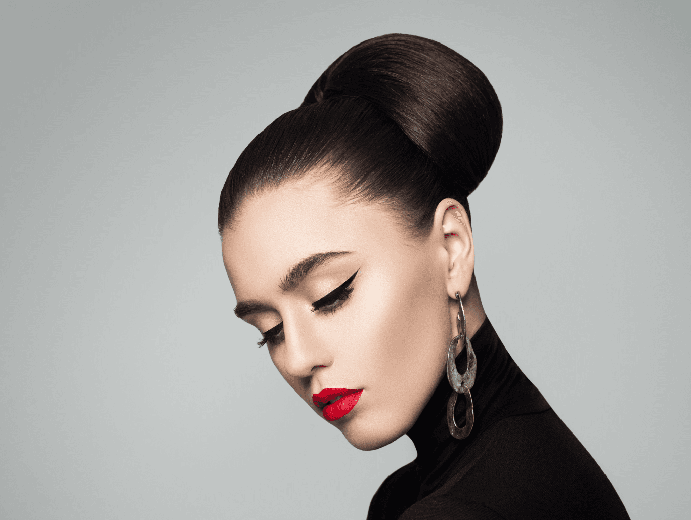 Woman with sleek, elegant updo showcasing expert occasional styling at John Richards Hairdressing, Allington, Maidstone, perfect for weddings and events.