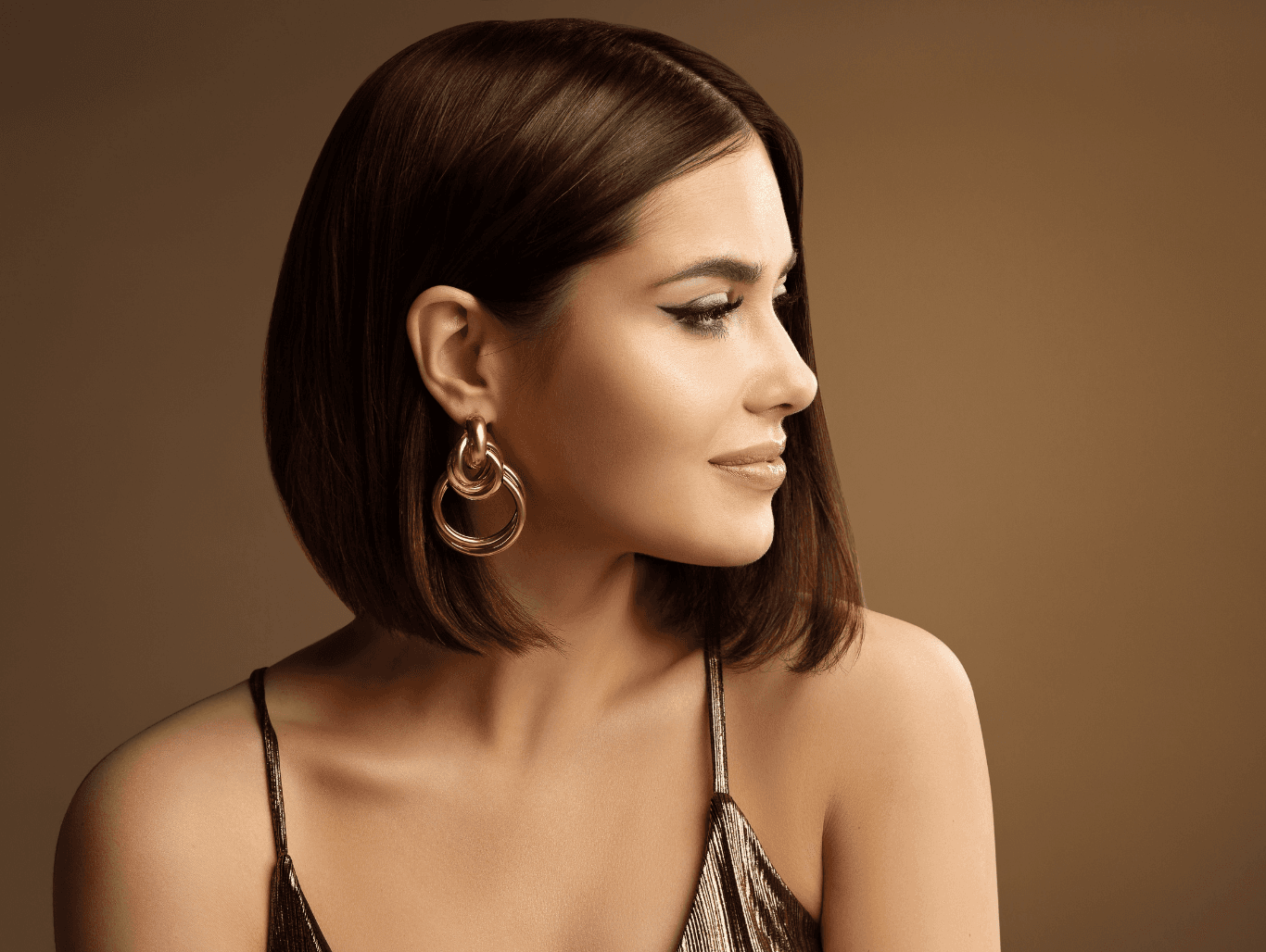 Woman with sleek, freshly tinted hair showing flawless root coverage, created with a regrowth tint at John Richards Hairdressing, Allington, Maidstone.
