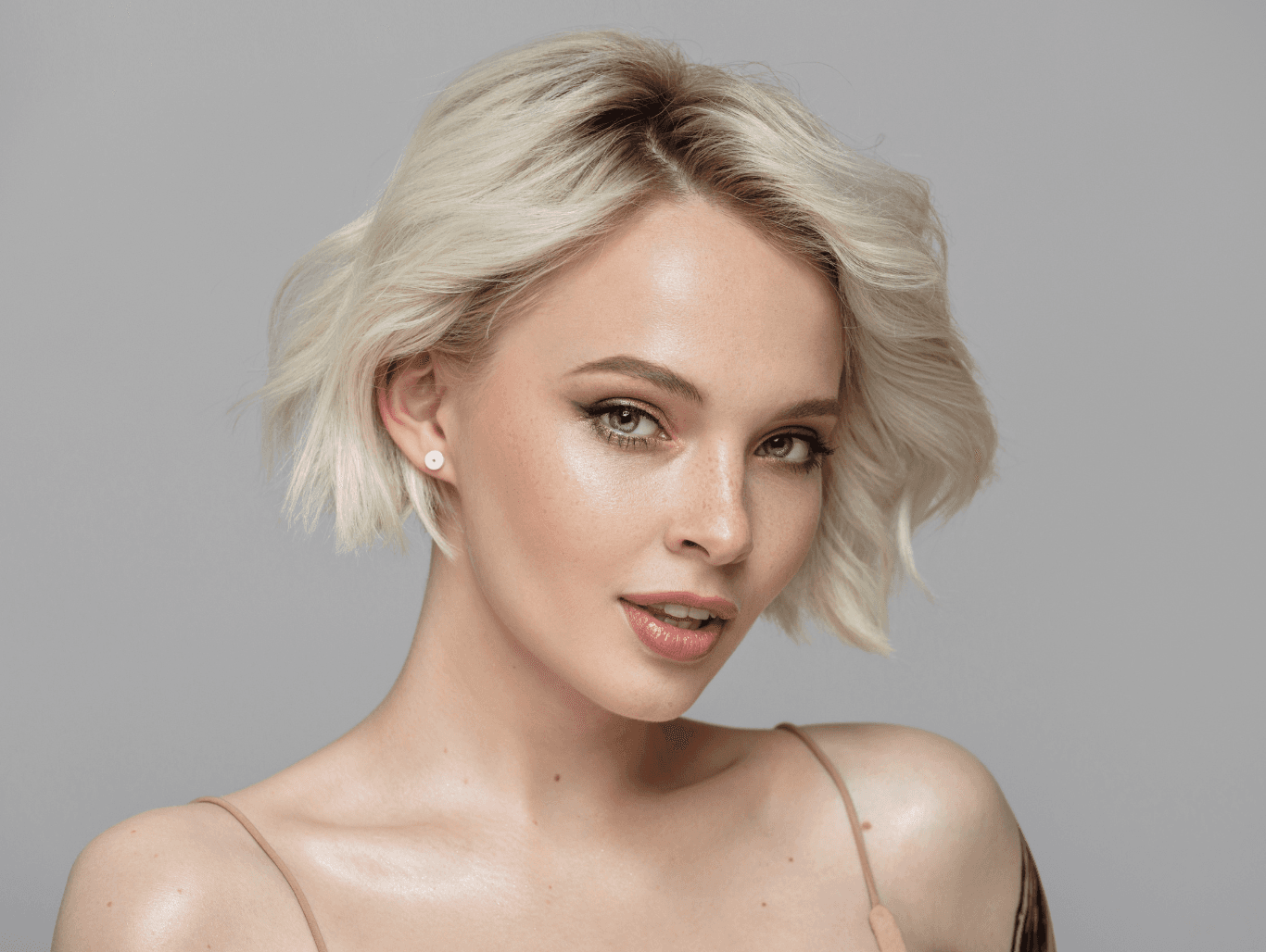 Woman with short, softly highlighted blonde hair, showcasing expert T-section highlights at John Richards Hairdressing in Allington, Maidstone.